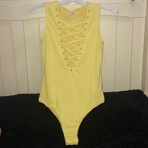 YELLOW SLEEVELESS BODYSUIT